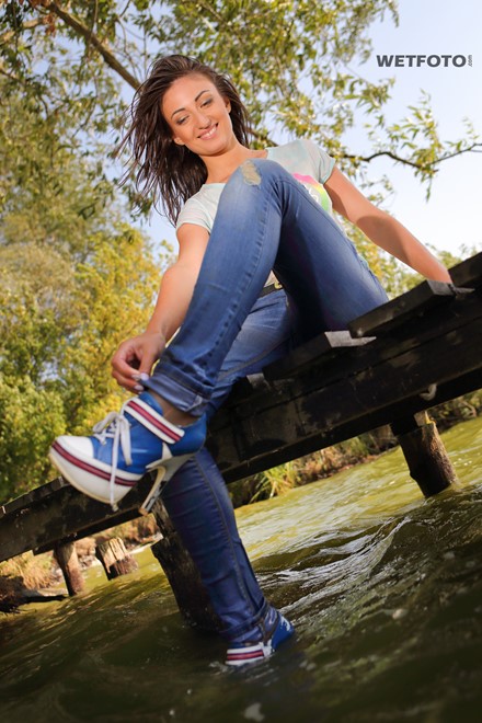 wet girl brunette wet hair get wet soaked fully clothed ripped tight jeans high heels shoes t-shirt lake
