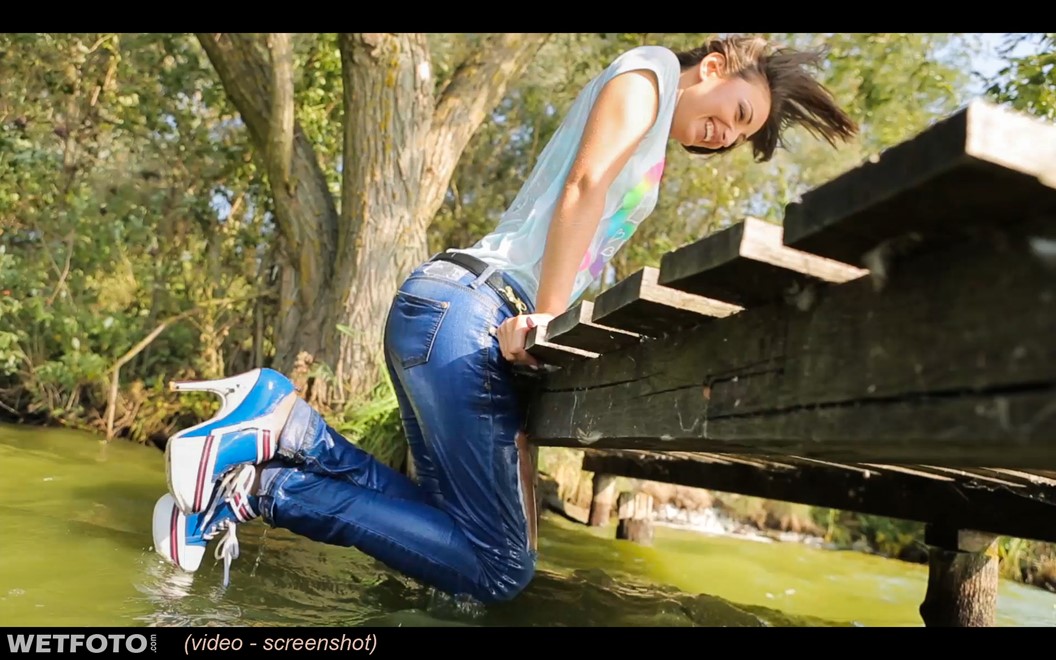 wet girl brunette wet hair get wet soaked fully clothed ripped tight jeans high heels shoes t-shirt lake