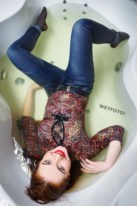wet girl fully clothed wet get wet soaking wet colorful golf jeans boots jacuzzi
