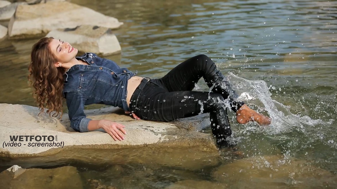 Wetlook By Beautiful Girl In Wet Denim Jacket And Skinny Jeans On Lake