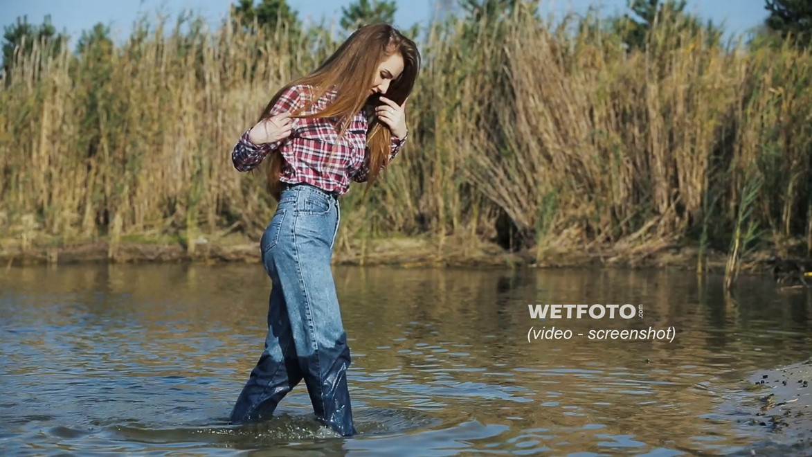 wet girl long haired swim fully clothed water wet clothes jeans shirt tights shoes wet hair lake