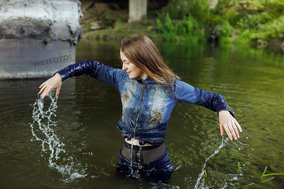 Fully Clothed Girl In Jacket Jeans And Tights Get Wet By The River Wetlookone