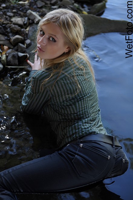 Wetlook By Beautiful Girl In Jeans Shirt And Shoes By The River