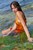 wet girl brunette wet hair get wet swimming fully clothed orange dress sea