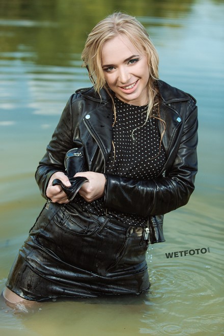 wet girl soaked get wet swimming fully clothed tights leather jacket skirt high heels lake