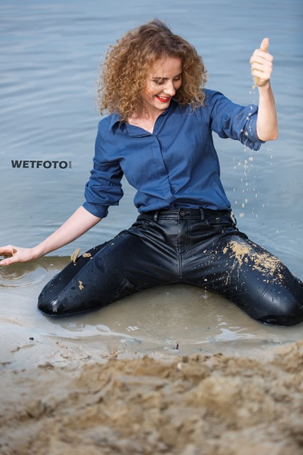 wet girl wet hair get wet swimming fully clothed shirt leather pants high heels lake