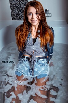 #408 - Wetlook by Sexy Girl in Fully Wet Jacket, Denim Shorts, Stockings and Sneakers in Shower